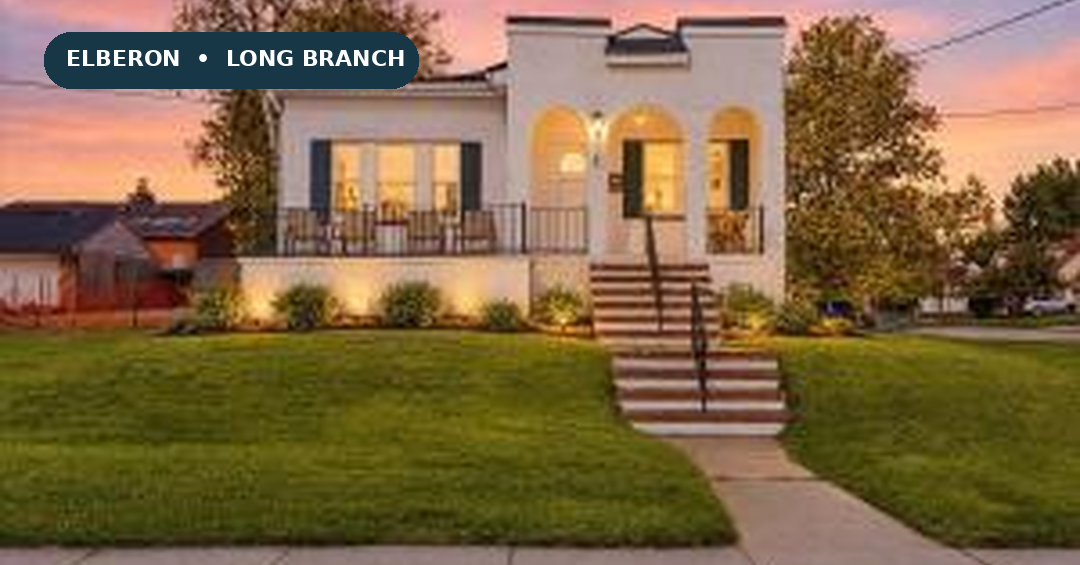 Front exterior of 1 Clarence Avenue in Elberon, with its lawn and front porch.